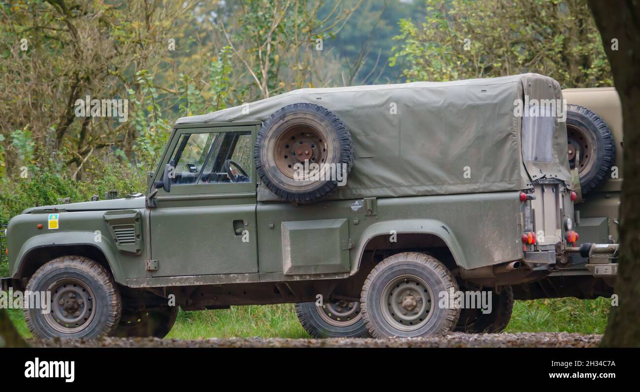a british army Land Rover Defender Wolf truck utility medium military  vehicle parked on a military exercise Wiltshire UK Stock Photo - Alamy