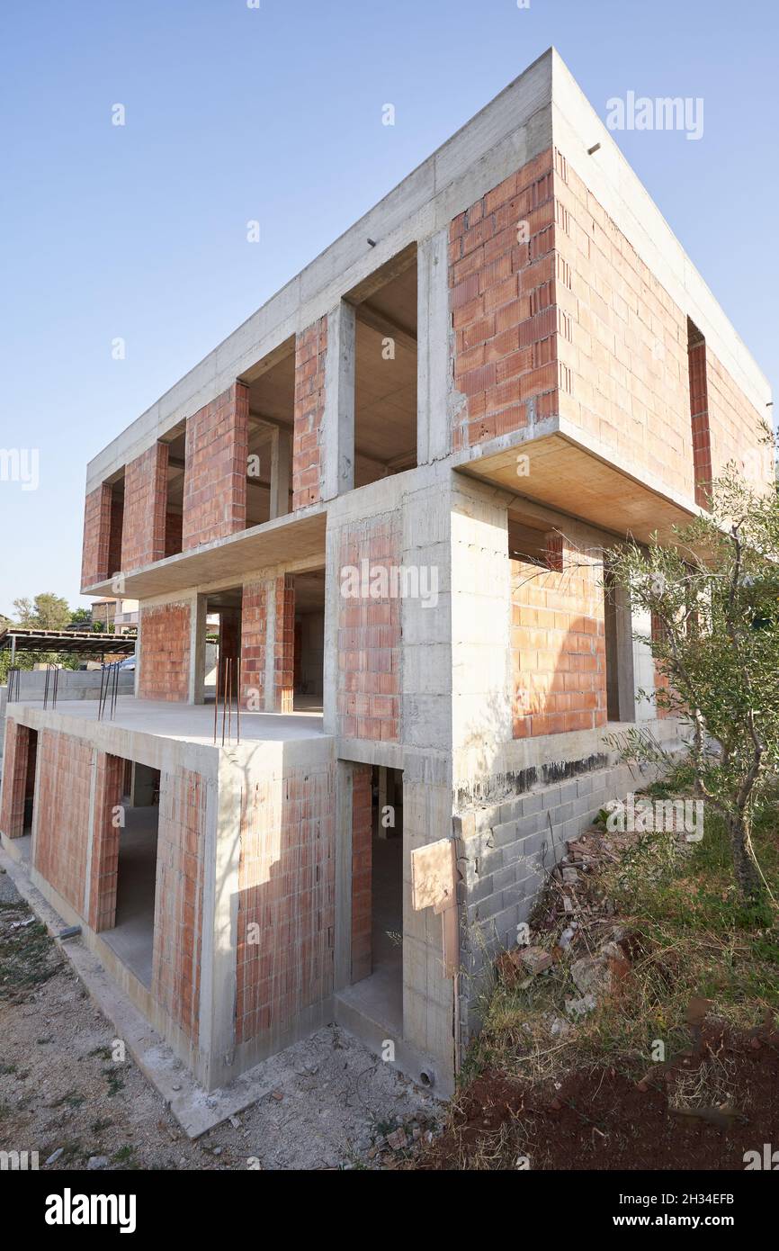 Construction site of a modern private house with a flat roof. Stock Photo