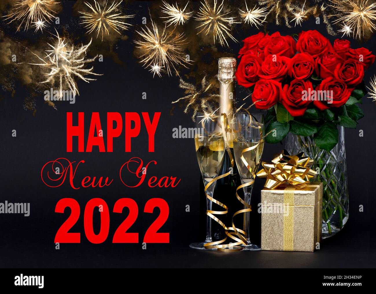 Happy New Year 2022. Red roses, bottle of champagne, golden gift box Stock Photo