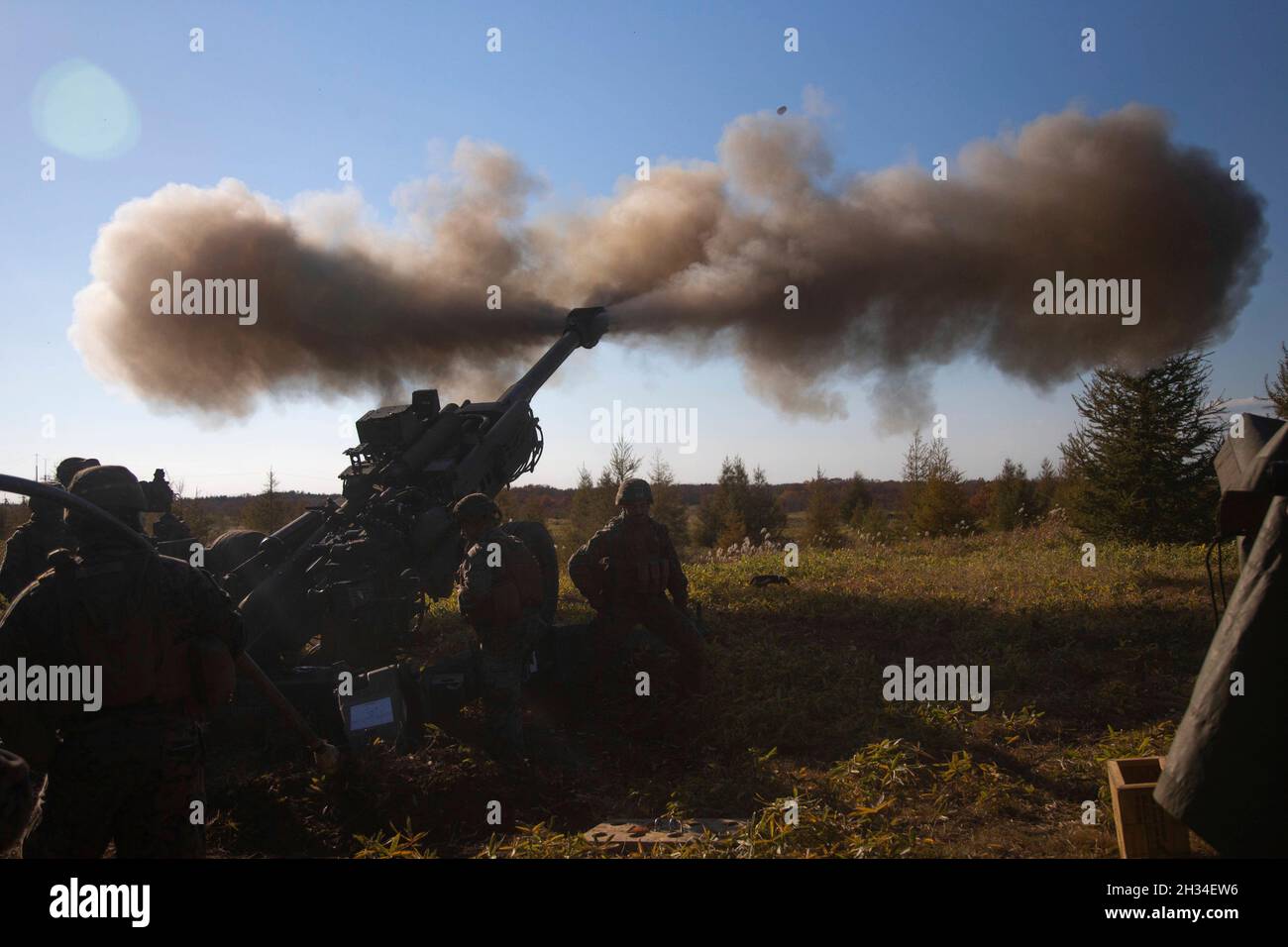 Yausubetsu Maneuver Area, Japan. 24th Oct, 2021. U.S. Marines with the 3d Marine Division, fire an M777A2 155mm Howitzer during Artillery Relocation Training at Yausubetsu Maneuver Area October 24, 2021 in Hokkaido, Japan. Credit: LCpl. Lorenzo Ducato/US Marines Photo/Alamy Live News Stock Photo