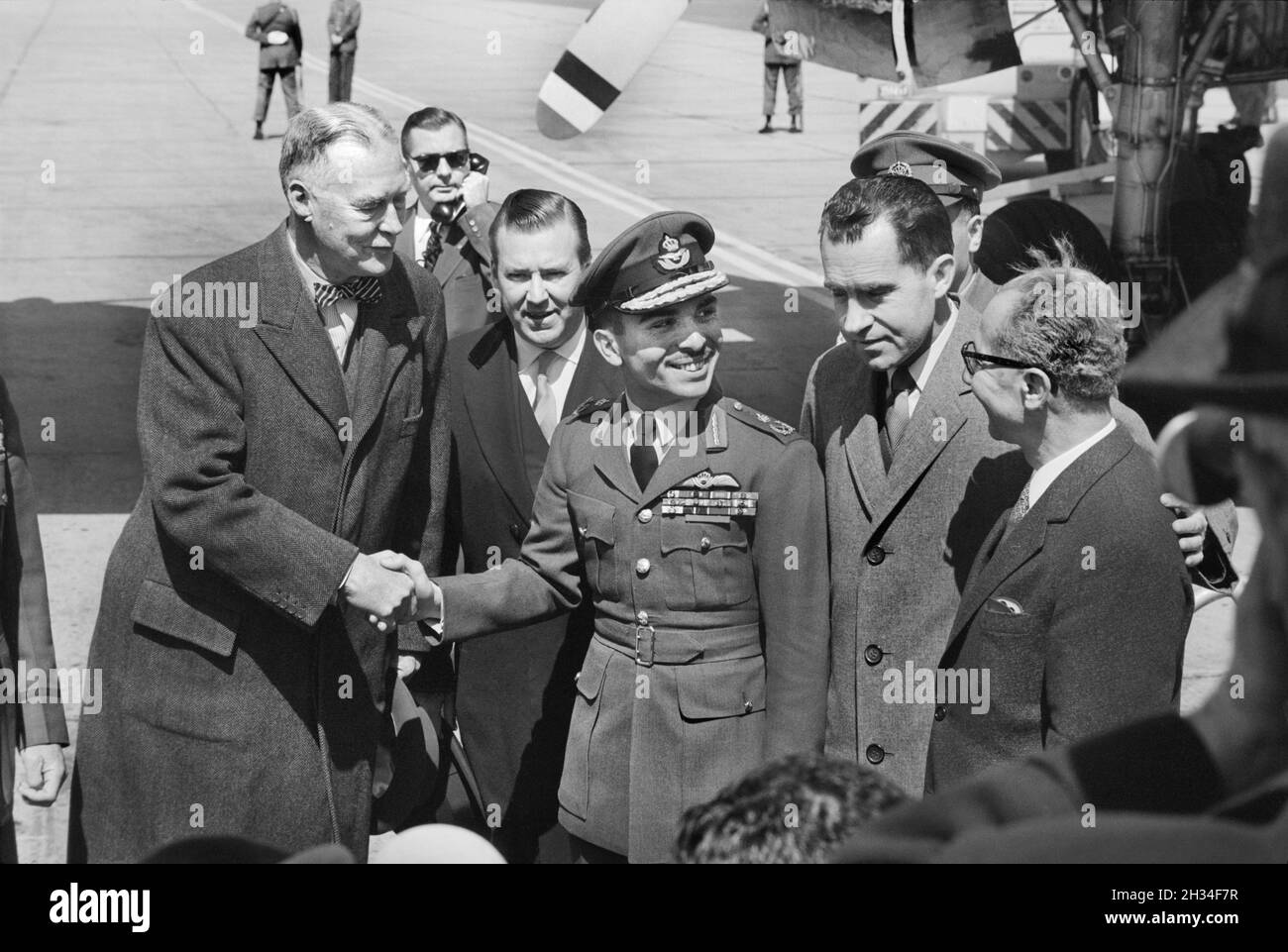 King Hussein of Jordan, with Vice President Richard Nixon and others, on his arrival for an unofficial visit to the United States, National Airport, Arlington, Virginia, USA, Marion S. Trikosko, US News & World Report Magazine Collection, March 19, 1959 Stock Photo