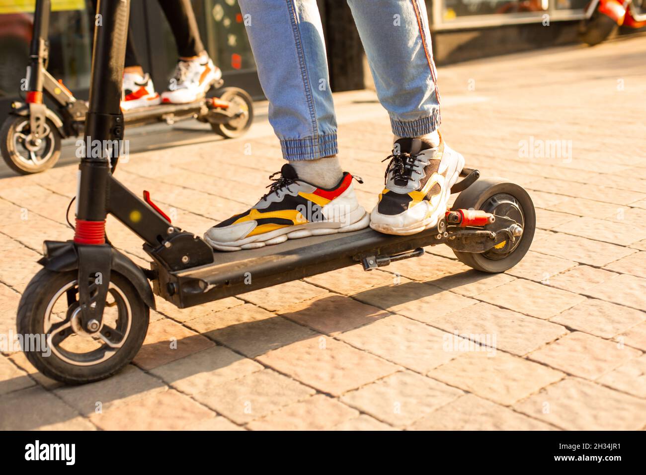The young man have nice mood while rides an electric scooter Stock
