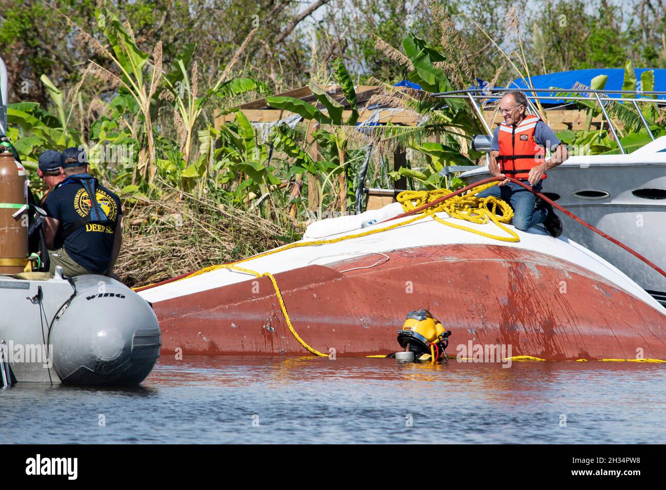 Golden Meadow, United States of America. 19 September, 2021. U.S. Coast Guard, Navy and Army members assist in clearing sunken vessels from waterways in the aftermath of Hurricane Ida September 19, 2021 in Golden Meadow, Louisiana. Credit: Brigida Sanchez/FEMA/Alamy Live News Stock Photo