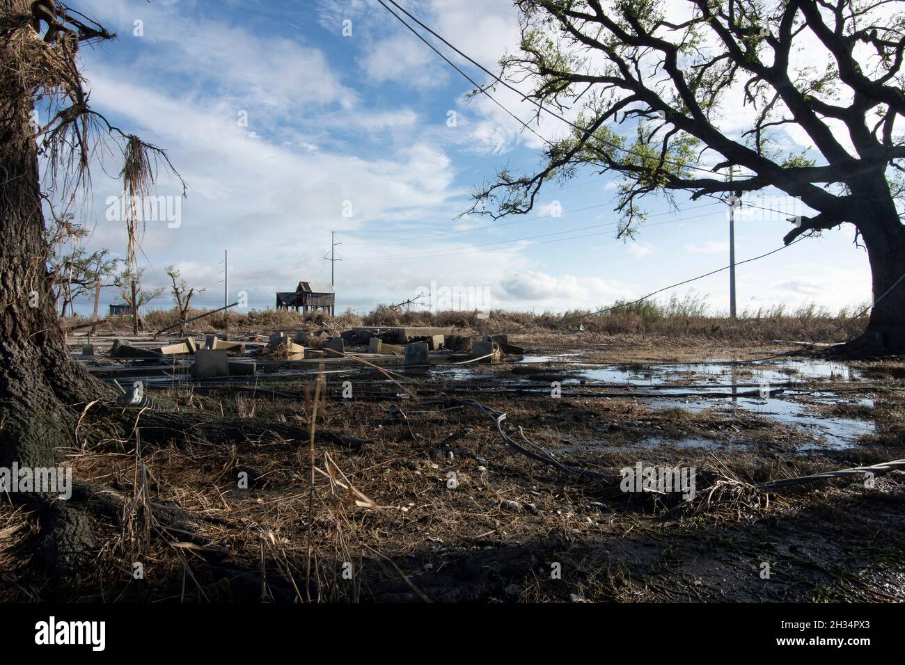 Golden Meadow, United States of America. 19 September, 2021. Debris is scattered along Mink Bayou where homes once stood in the aftermath of Hurricane Ida September 19, 2021 in Golden Meadow, Louisiana. Credit: Brigida Sanchez/FEMA/Alamy Live News Stock Photo