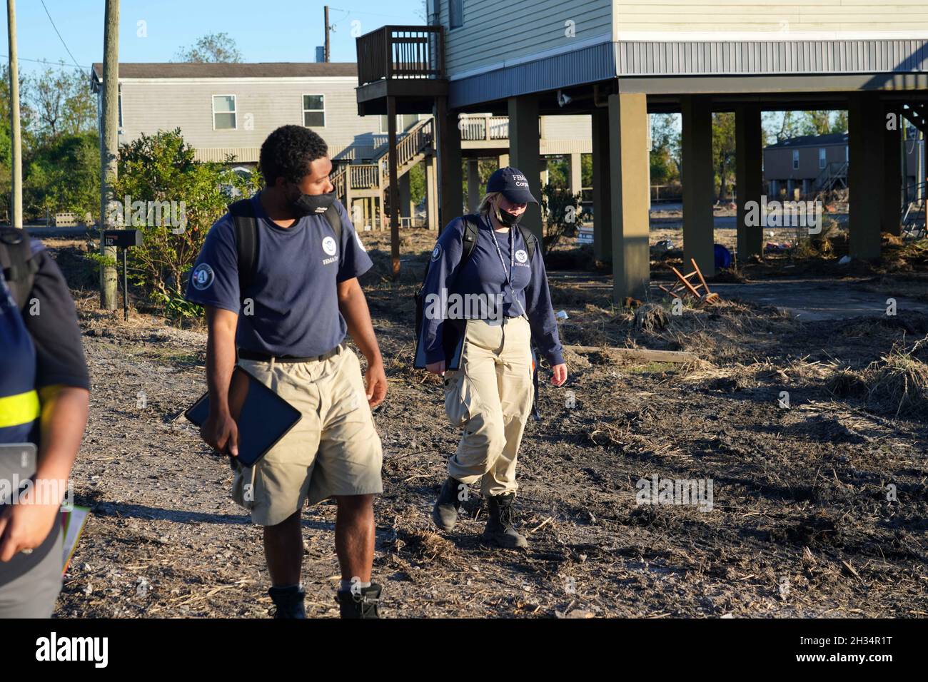 Ironton, United States of America. 24 September, 2021. FEMA Disaster Survivor Assistance staff walking door to door registering and answering questions for residents of the historically underserved communities in the aftermath of Hurricane Ida September 24, 2021 in Ironton, Louisiana. Credit: Julie Joseph/FEMA/Alamy Live News Stock Photo