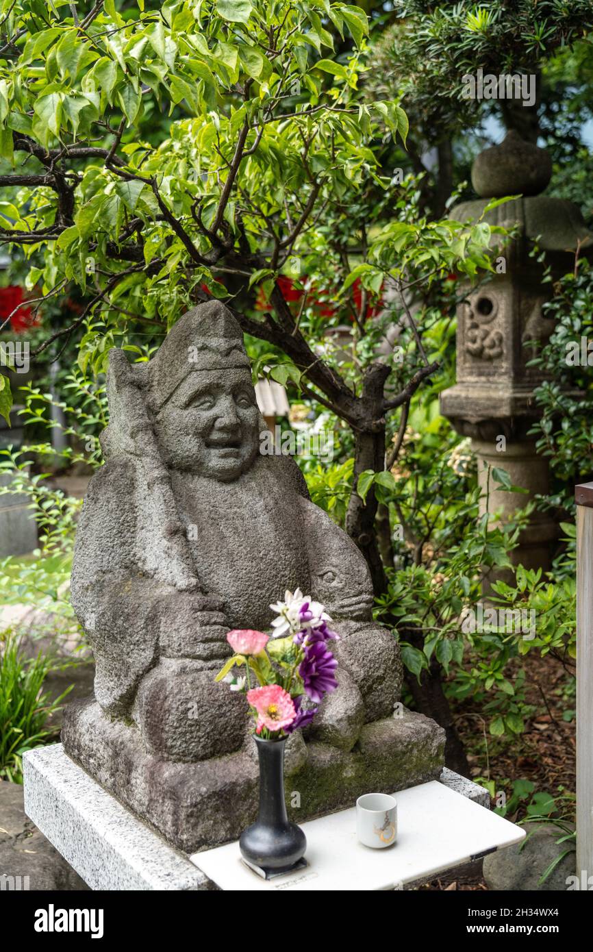 A statue of Ebisu, one of the Seven Gods of Fortune at the Toyokawa Inari Betsuin temple in