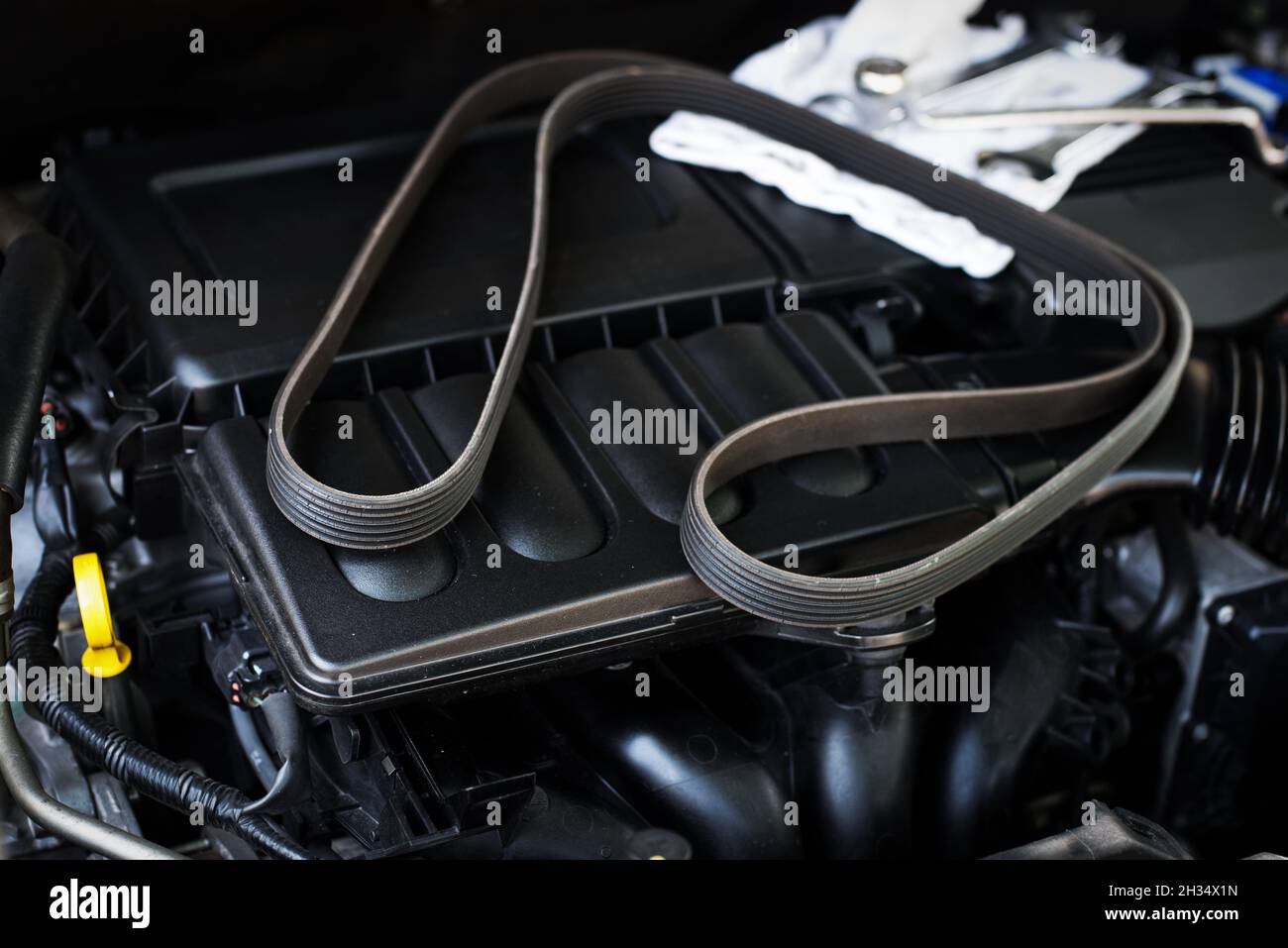 closeup old timing belt with many cracks in the engine room Stock Photo