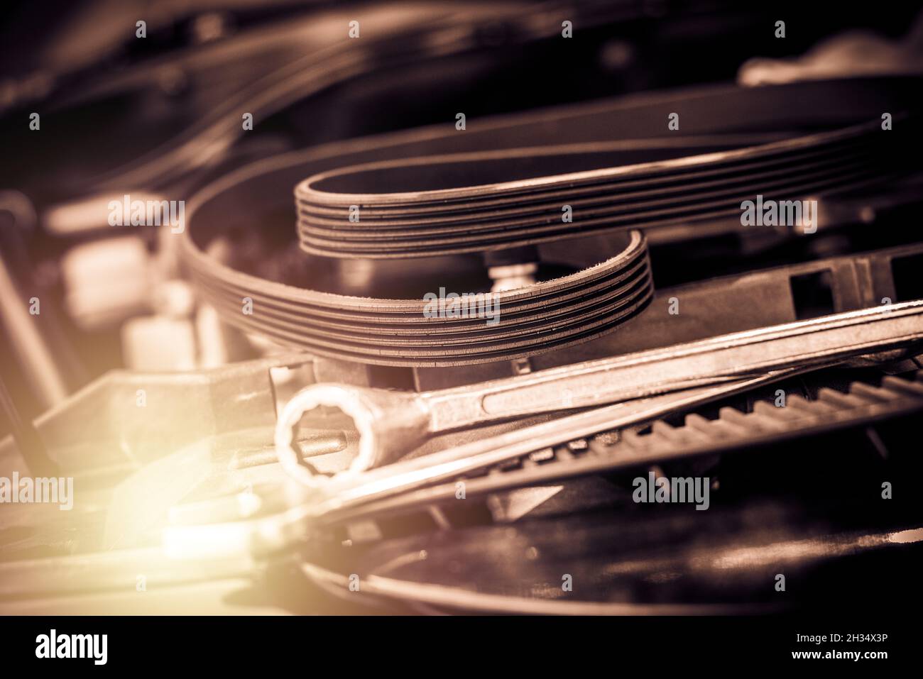 closeup old timing belt with many cracks in the engine room Stock Photo