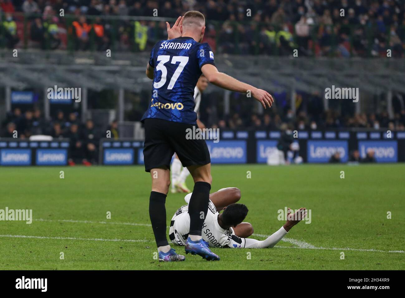 Milan, Italy, 24th October 2021. Milan Skriniar of FC Internazionale accuses Alex Sandro of Juventus of feigning injury following a clash with Denzel Dumfries of FC Internazionale, a challenge that was subsequently reviewed by the VAR, resulting in a penalty for Juventus during the Serie A match at Giuseppe Meazza, Milan. Picture credit should read: Jonathan Moscrop / Sportimage Stock Photo