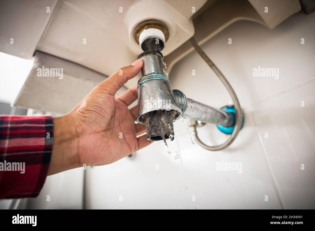 Repairing clogged and leaky washbasin sewer in the bathroom Stock Photo Alamy