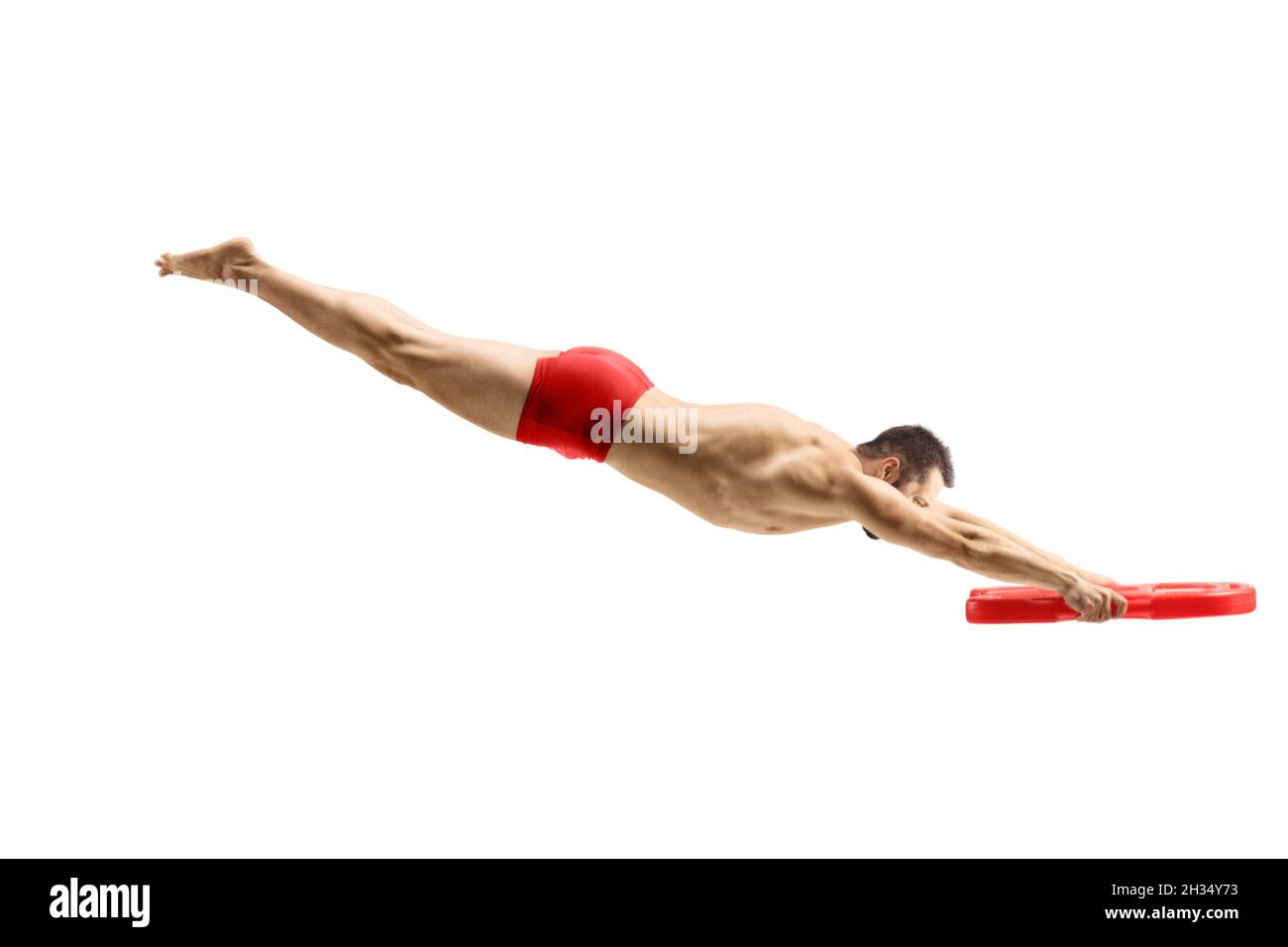 Male swimmer jumping and holding a swimming float isolated on white background Stock Photo