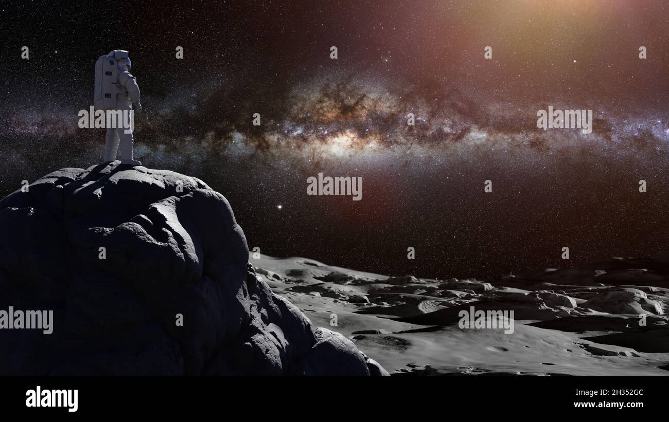 astronaut on the Moon, spaceman watching the Milky Way galaxy Stock Photo