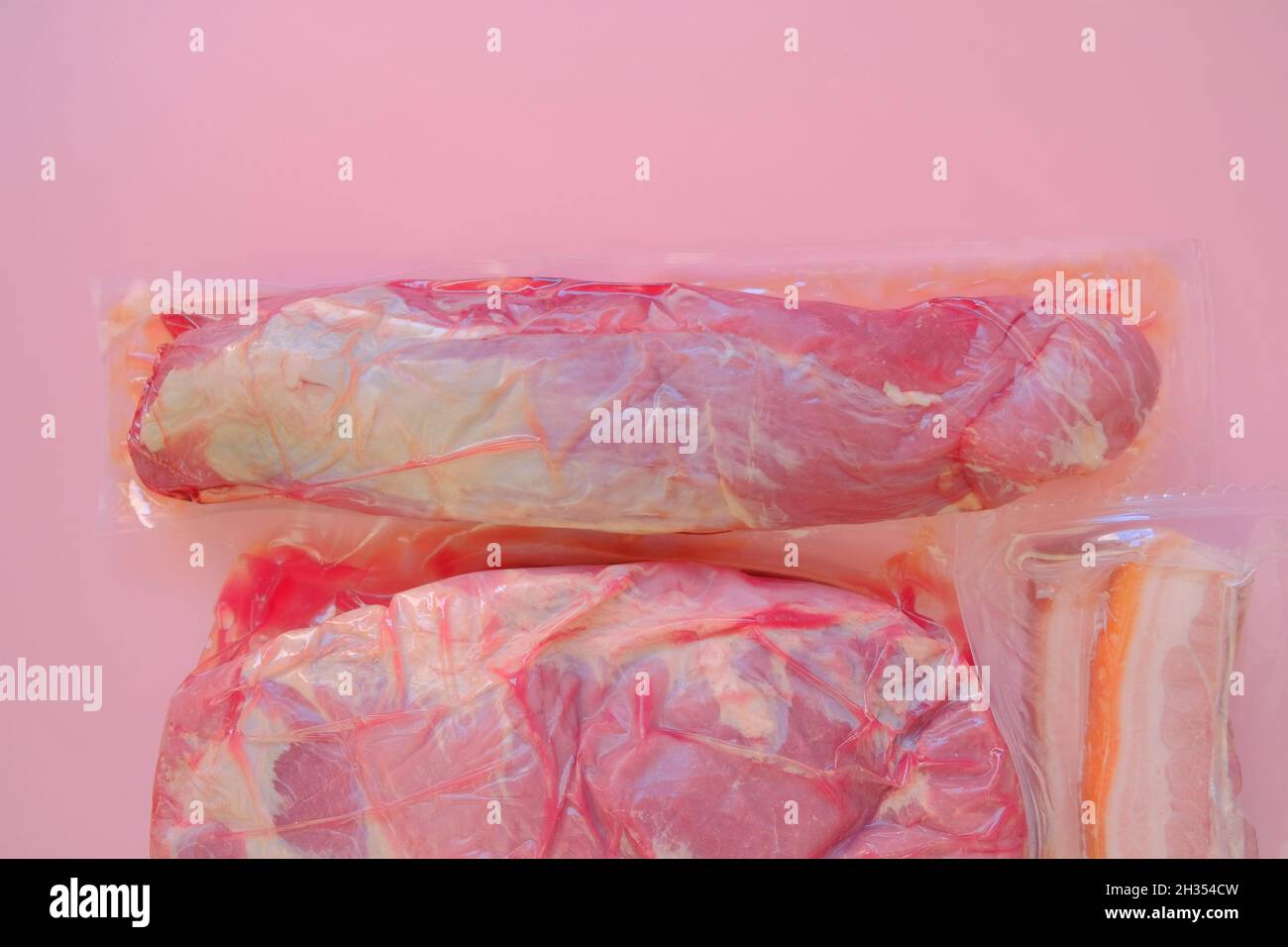 Pork meat.Fresh pork pieces . Protein foods.Vacuum packed meat on a