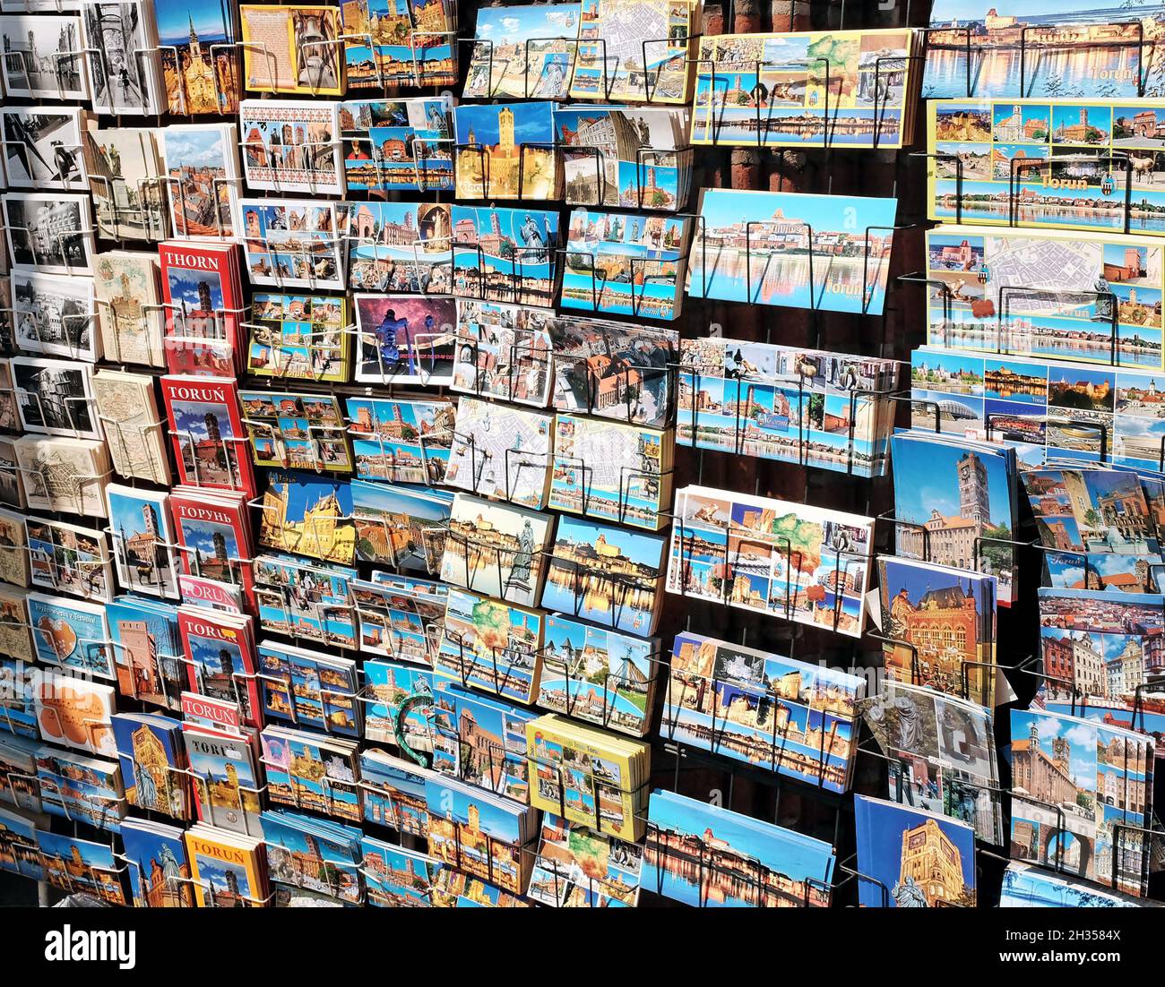 A display of tourist postcards and books in the old town of Torun, Poland. Stock Photo