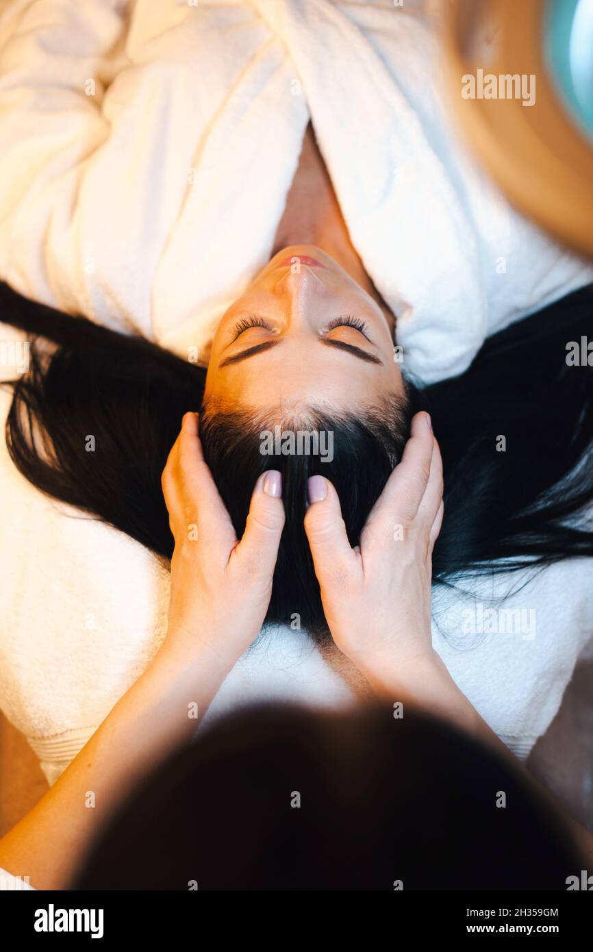 Woman receiving the scalp massage in the spa salon Stock Photo Alamy