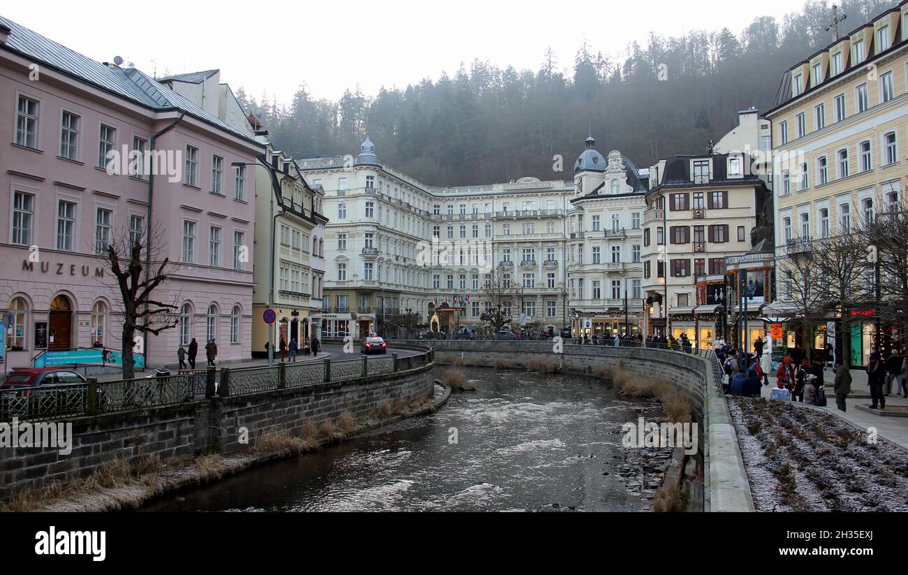 Tepla River in the resort area of the town, iconic 18th-century Grandhotel Pupp in the background, Karlovy Vary, Czech Republic Stock Photo