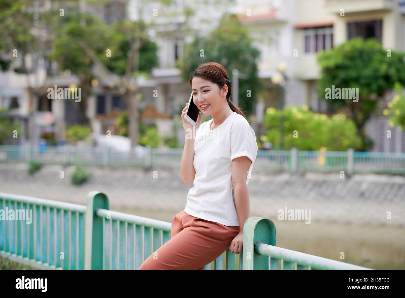 Woman standing outside hi-res stock photography and images - Alamy