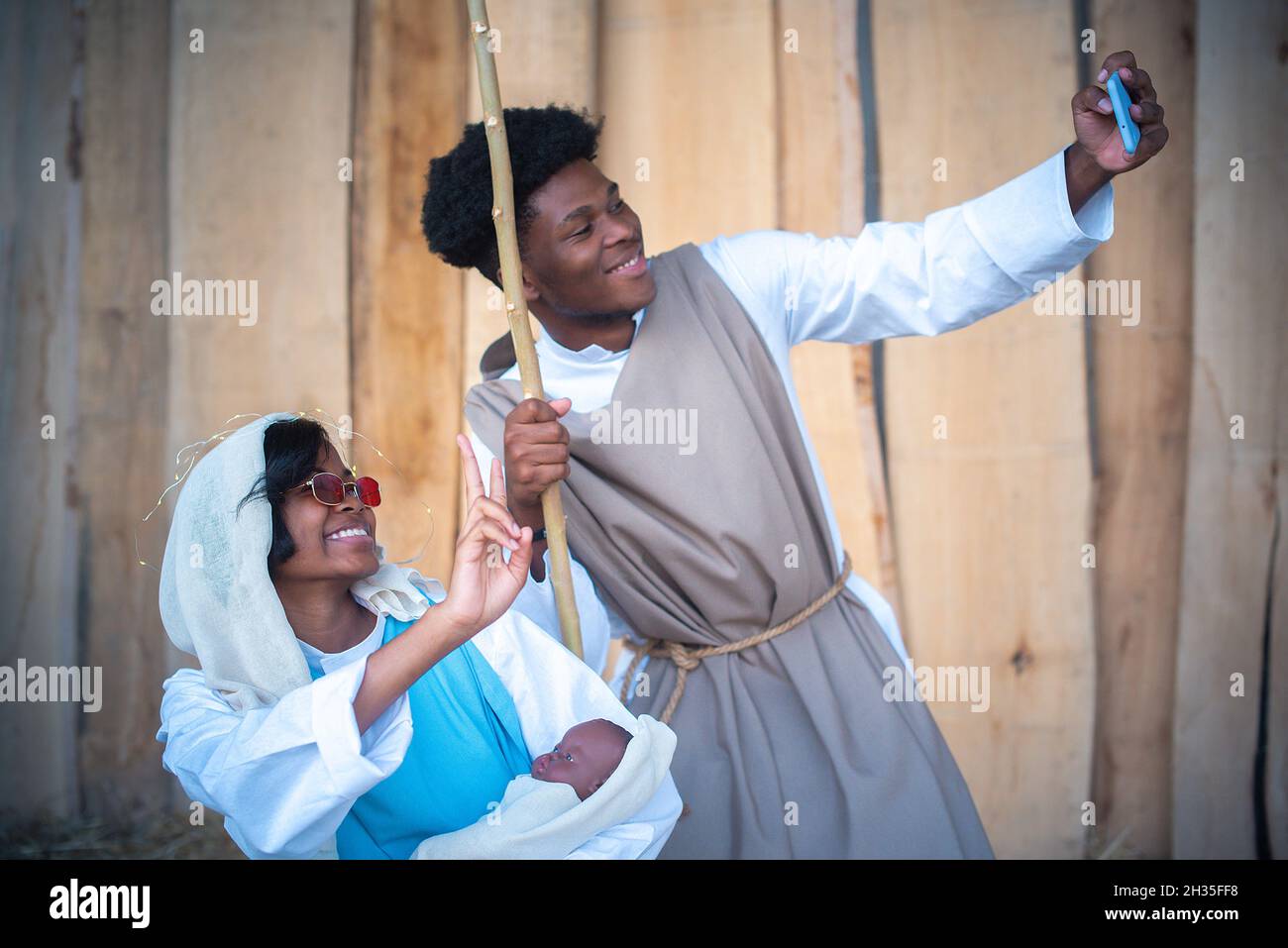 Modern nativity scene representation with black characters taking a