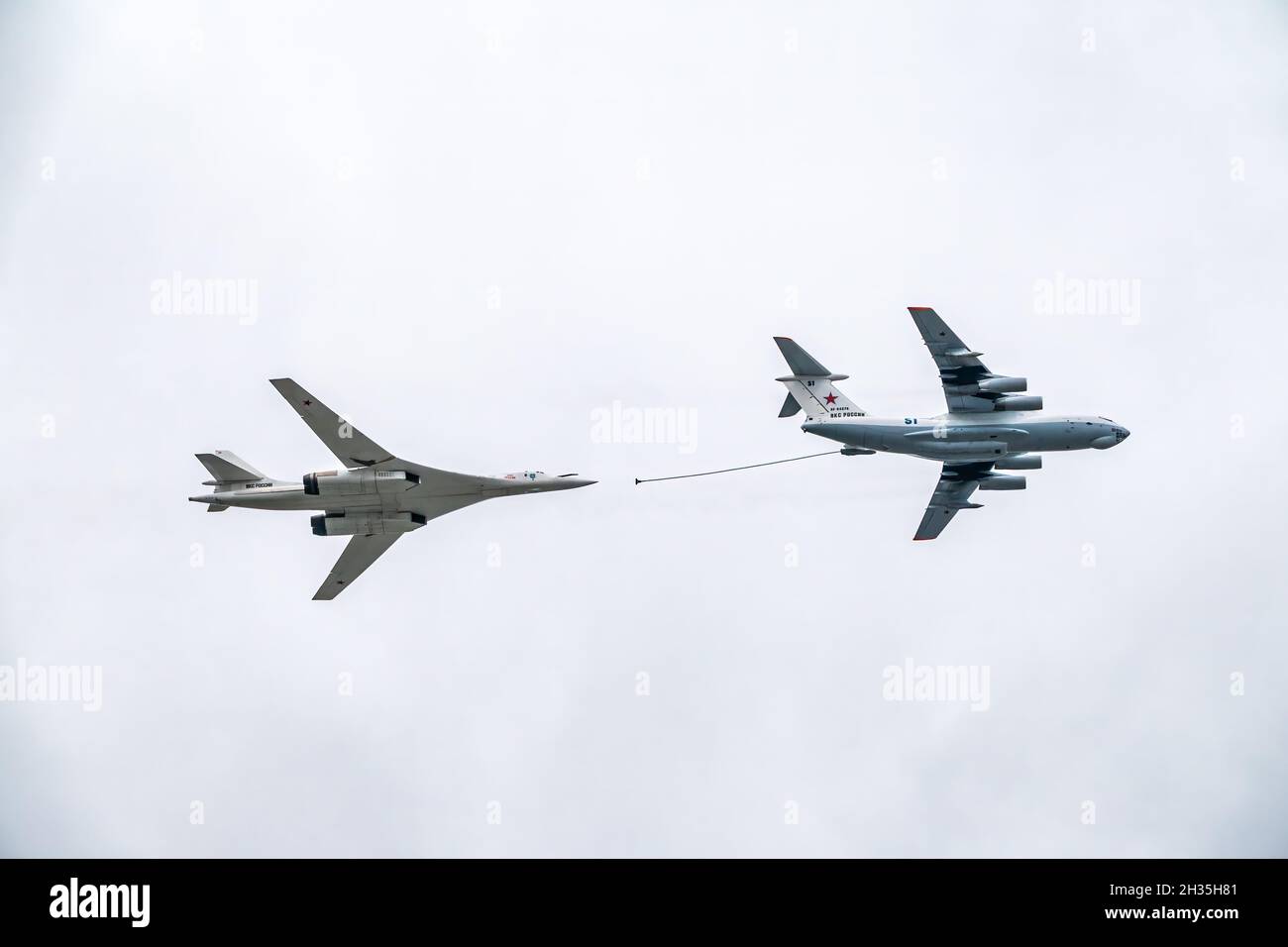 Moscow, Russia - May, 09, 2021: The group of supersonic strategic bomber of long-range aviation Tu-160 and flying tanker Il-78m fly over the Red Squar Stock Photo