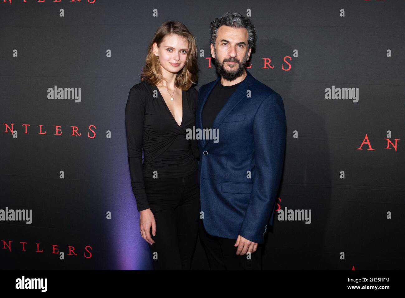 Michael Aronov (R) and guest attend the special screening of “Antlers”  at the Regal Essex Crossing & RPX in New York, New York on October 25, 2021. (Photo by Gabriele Holtermann/Sipa USA) Stock Photo