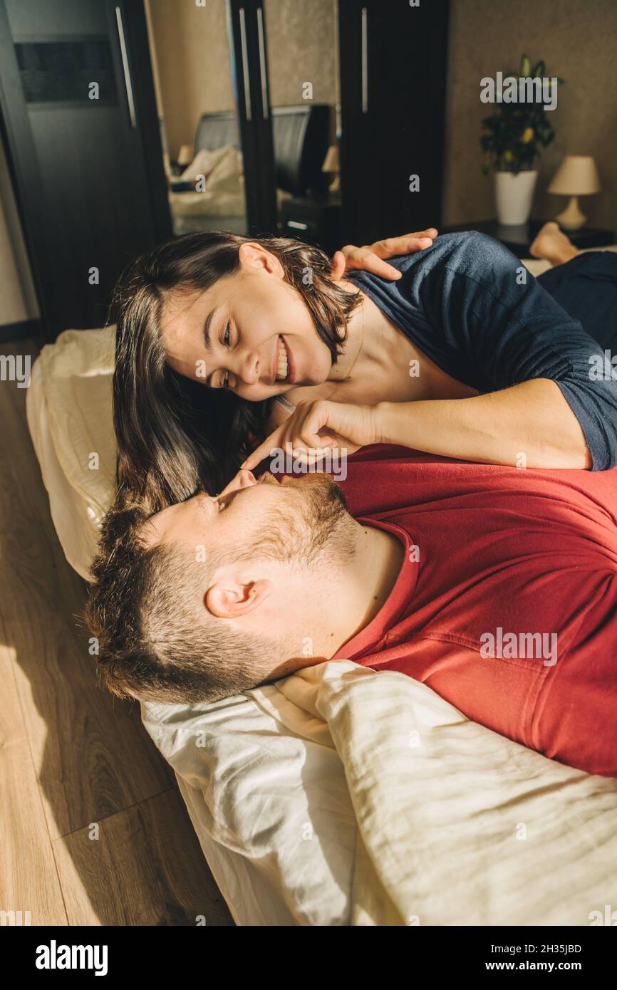 couple having fun in bed lovers spending time together Stock Photo