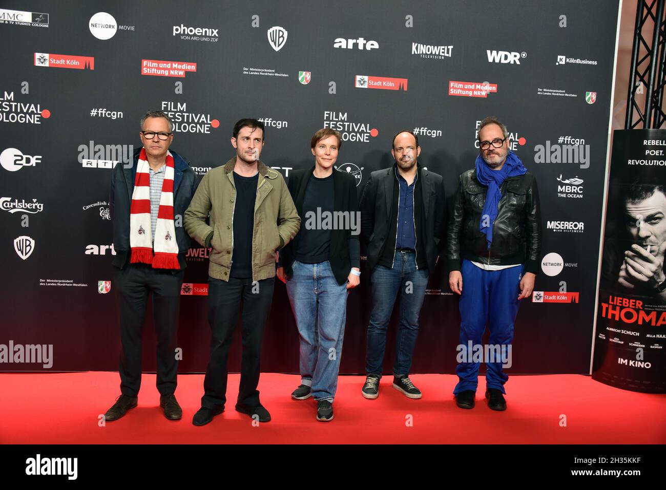 Cologne, Germany. 24th Oct, 2021. Christoph Friedel, Arthur Harari, not recognized, Nicolas Anthome and Stephan Holl, l-r, comes to the screening of Onoda - 10,000 Nights in the Jungle as part of the Film Festival Cologne. Credit: Horst Galuschka/dpa/Horst Galuschka dpa/Alamy Live News Stock Photo