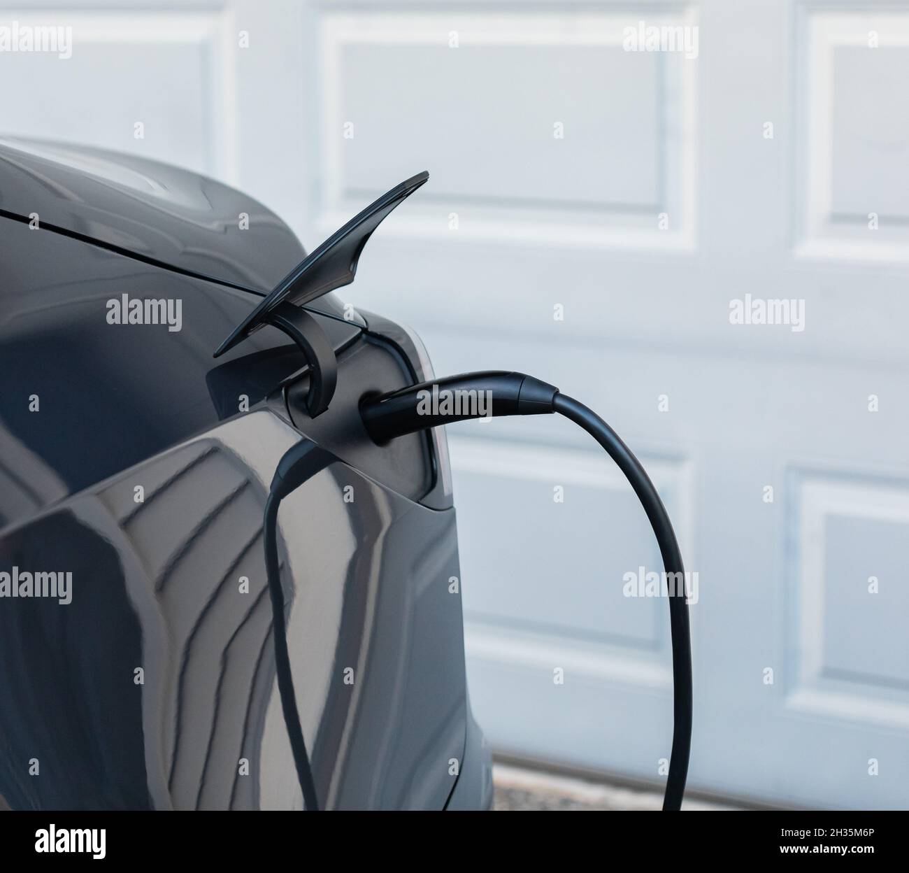 Electric Car Plug Close Up. Close up of the power supply plugged into