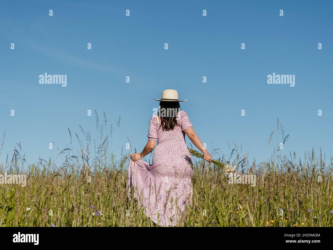 Wearing long dress hi-res stock photography and images - Alamy