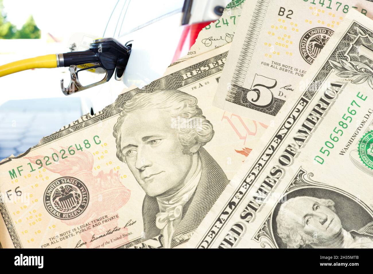 Gas station and dollar bills Stock Photo Alamy