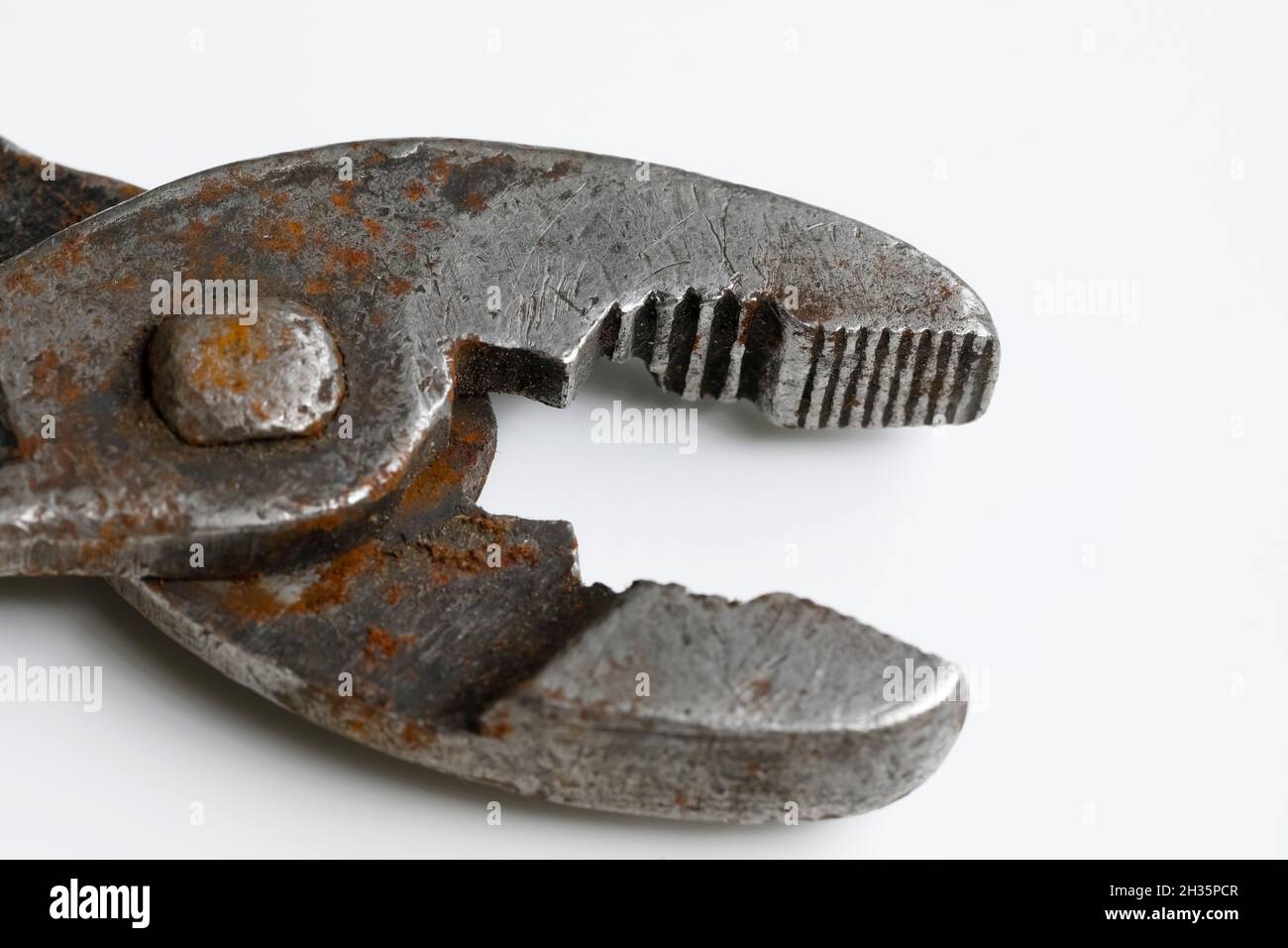 Old rusty pliers, old type of adjustable pincers which are still useful. Stock Photo