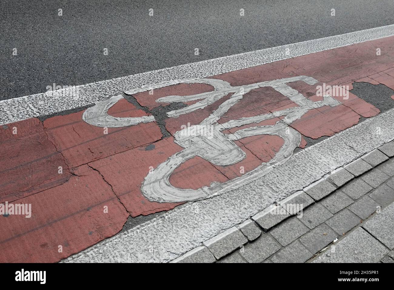 White bicycle symbol has been painted on the red bike lane Stock Photo ...