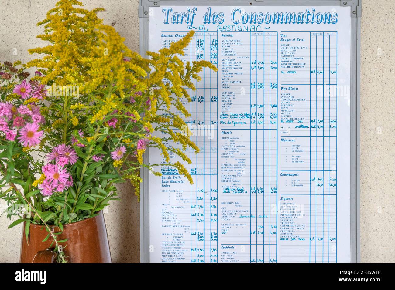 The price list for consumping drinks at the restaurant Au Bastignac in Labaside-d'Armagnac, southern France Stock Photo