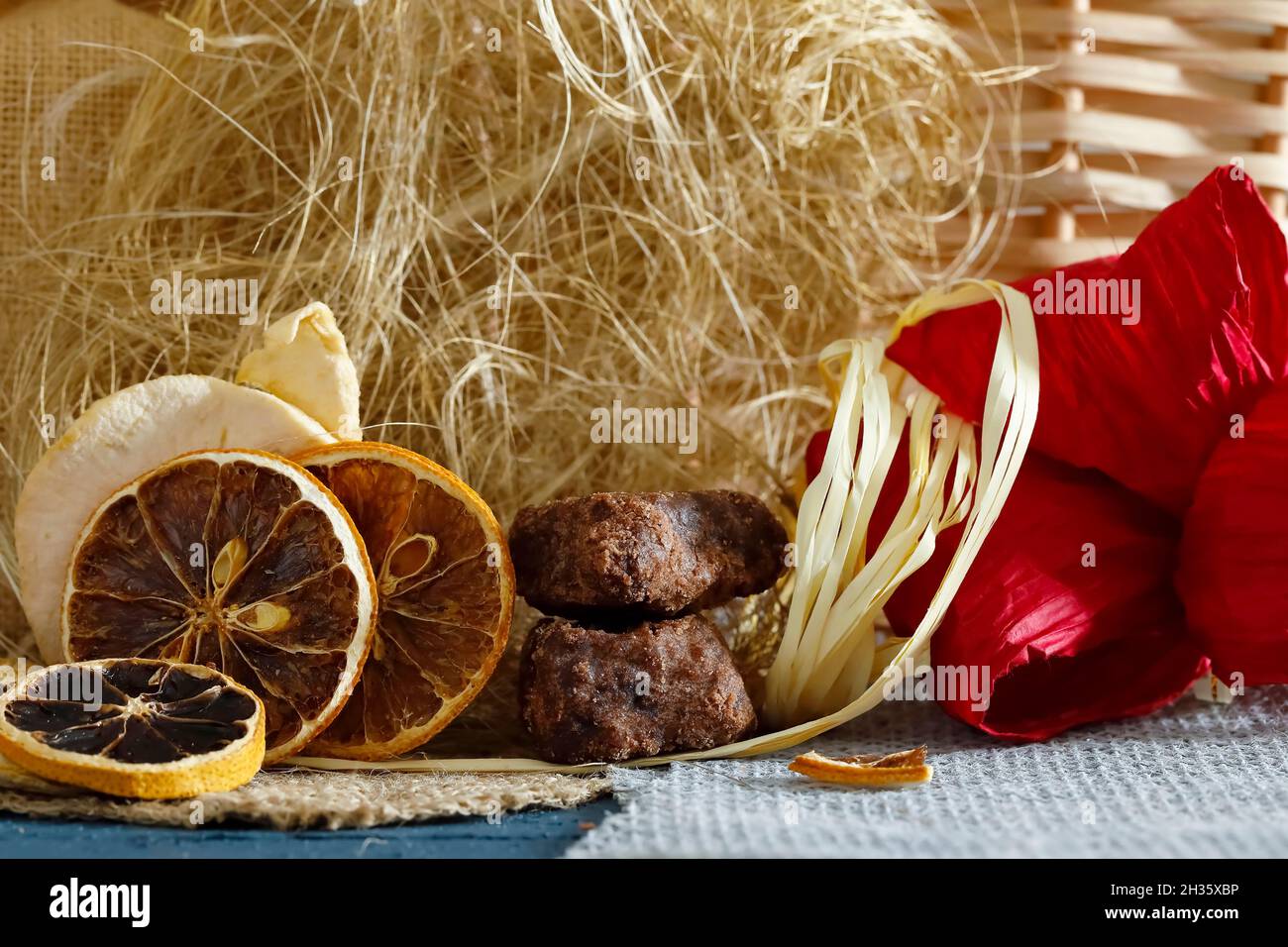 Gingerbread cakes and dried lemon and orange slices can be seen with additional decorative elements Stock Photo