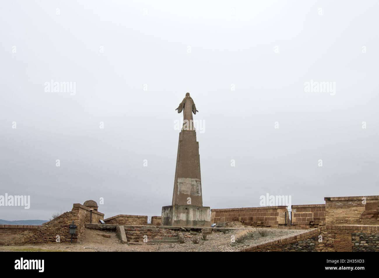 Tall statue of Jesus Christ under the blue sky Stock Photo - Alamy