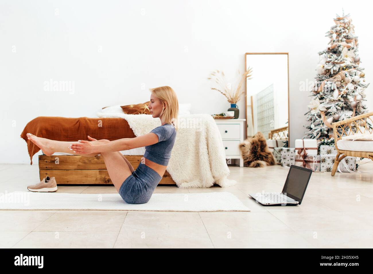 Young Woman Doing V Ups Abs Workout At Home Stock Photo Alamy