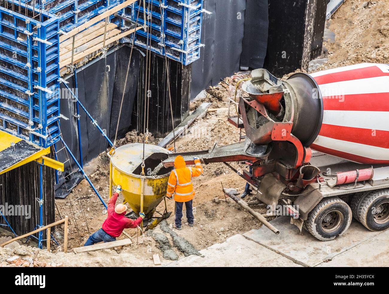Concreting work at the construction site. ?onstruction workers pour