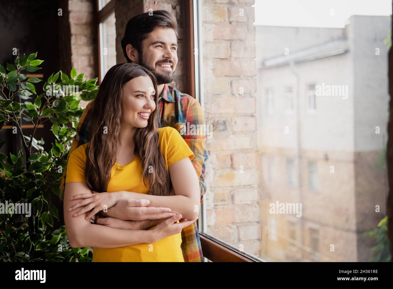 Photo of tender peaceful couple cuddle hug look window harmony time ...