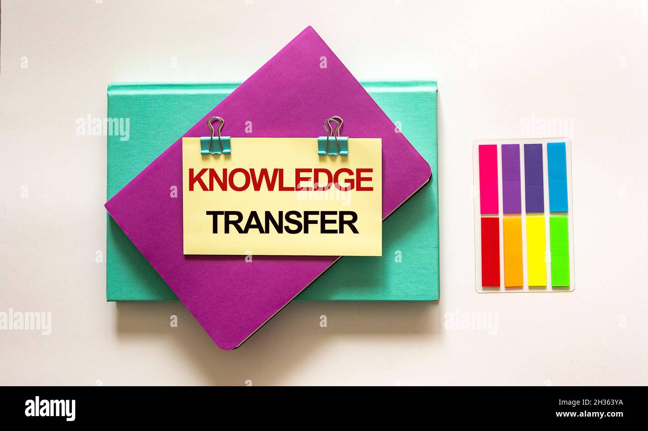 The Knowledge Exchange text is written on a sticker. Concept means deliberate exchange of information that helps in flexibility. Stock Photo