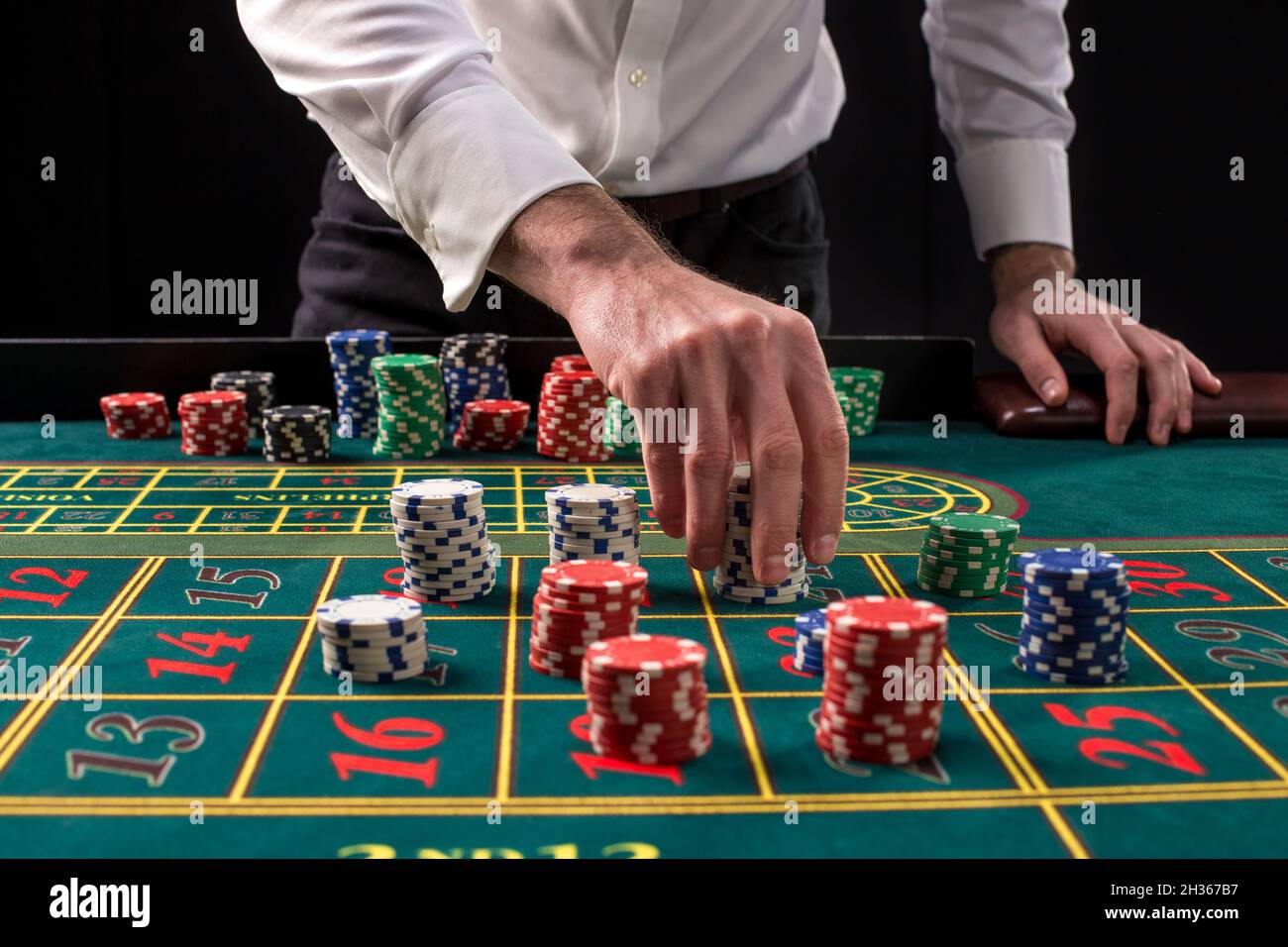 Casino table with roulette and chips Stock Photo - Alamy