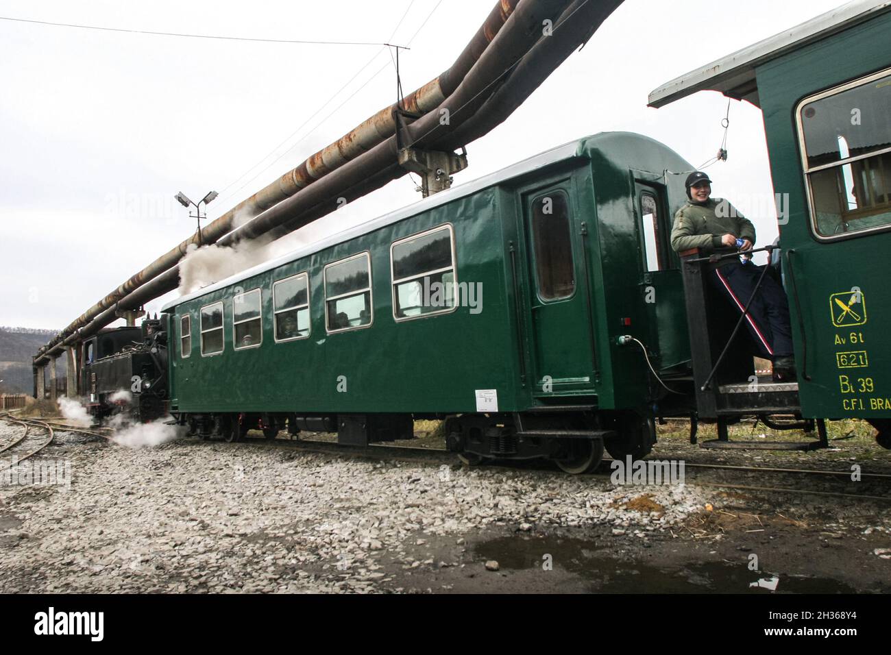 Brad, Romania, December12, 2009: Tourists are travel in an old steamed ...