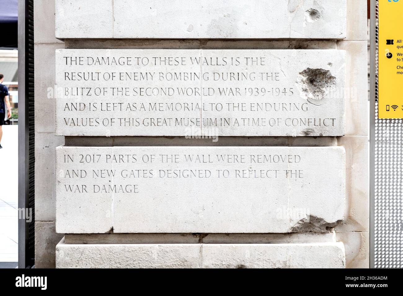Plaque, bullet holes and damage to the facade of Victoria & Albert