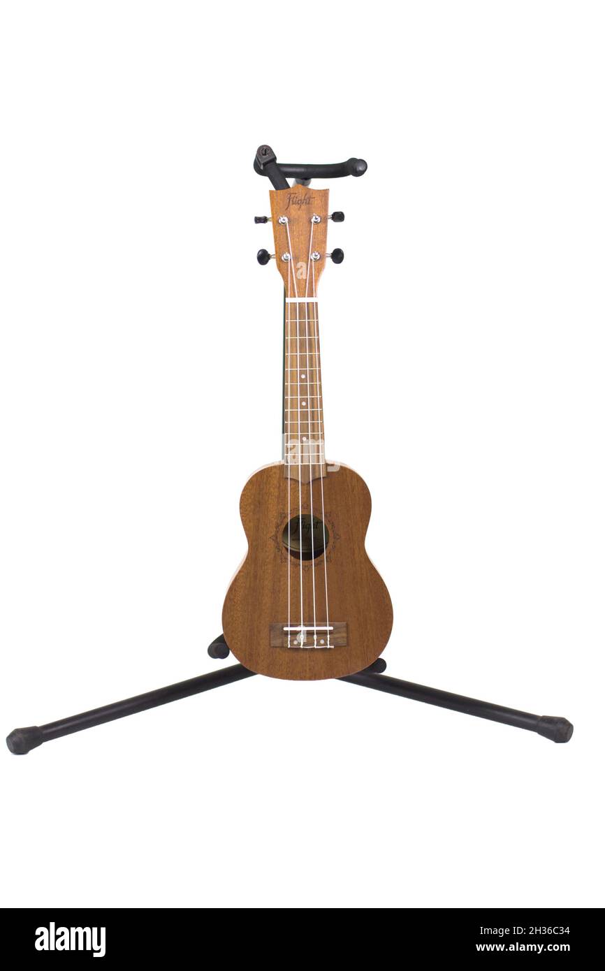 new ukulele guitars on white background Stock Photo - Alamy