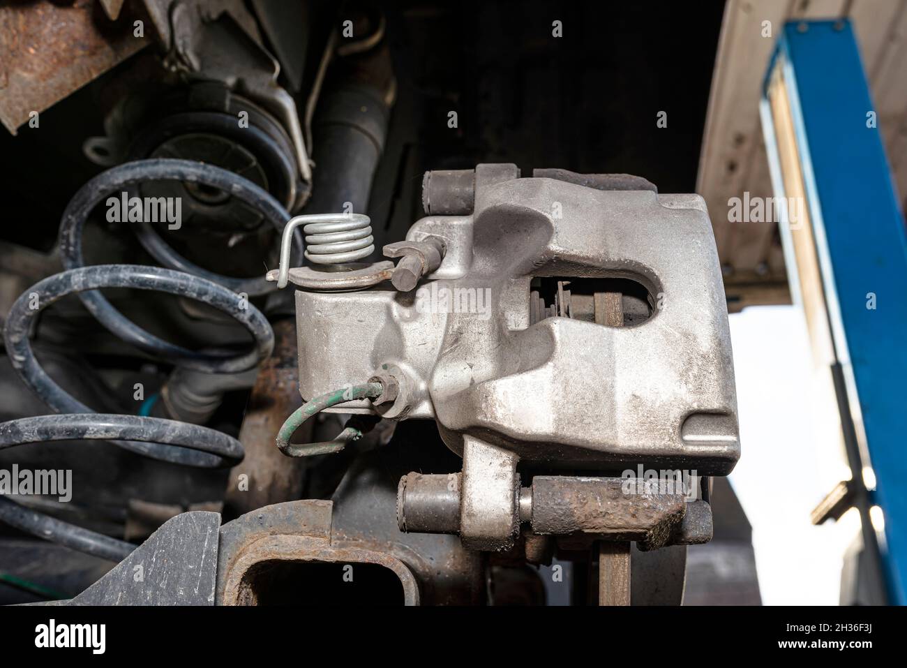 New rear brake calipers and brake discs with pads in a passenger car