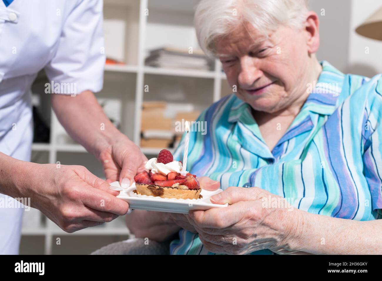 Woman receiving birthday cake hi-res stock photography and images - Alamy