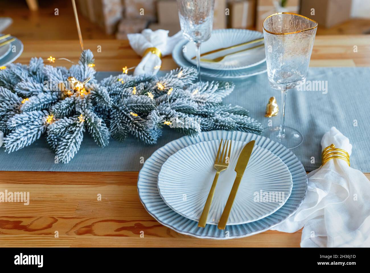 Elegant christmas table setting in gold and blue color for holiday ...