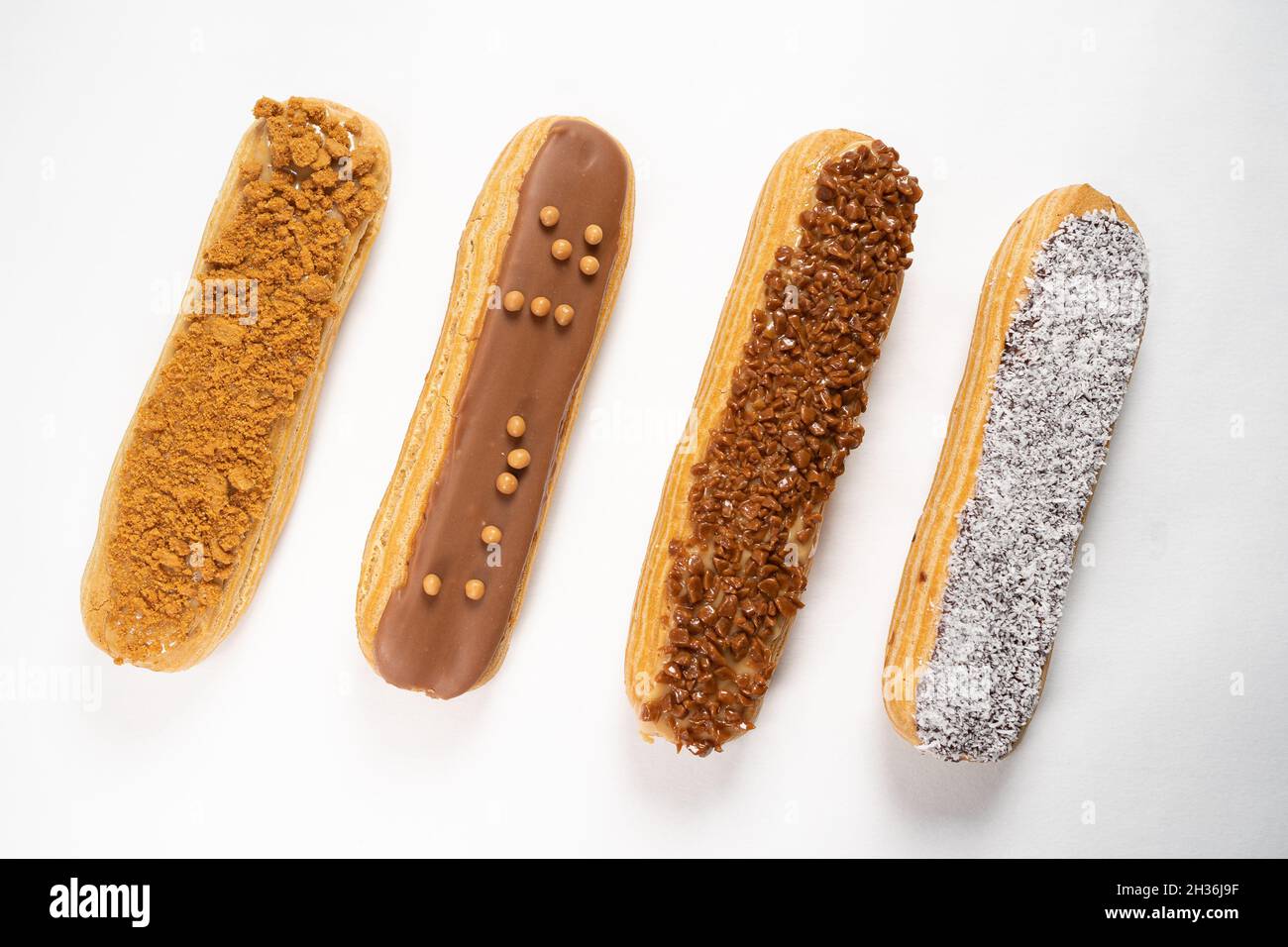 Closeup of eclairs on a white surface Stock Photo - Alamy