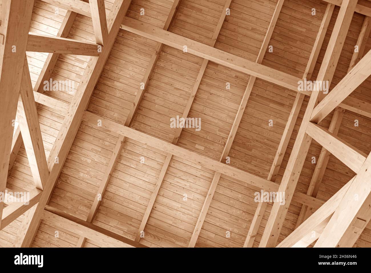 Wooden roof construction. Overlapping a wooden house. Stock Photo