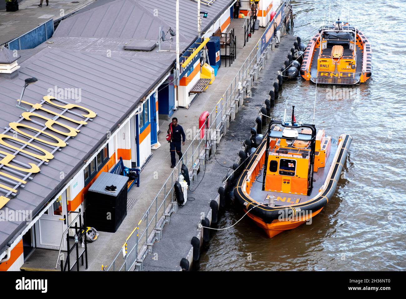 River Thames Royal Lifeboat National Lifeboat Institution Station Waterloo Bridge London With Two Rescue Boats Or Craft Tied To Dockside Moorings Stock Photo