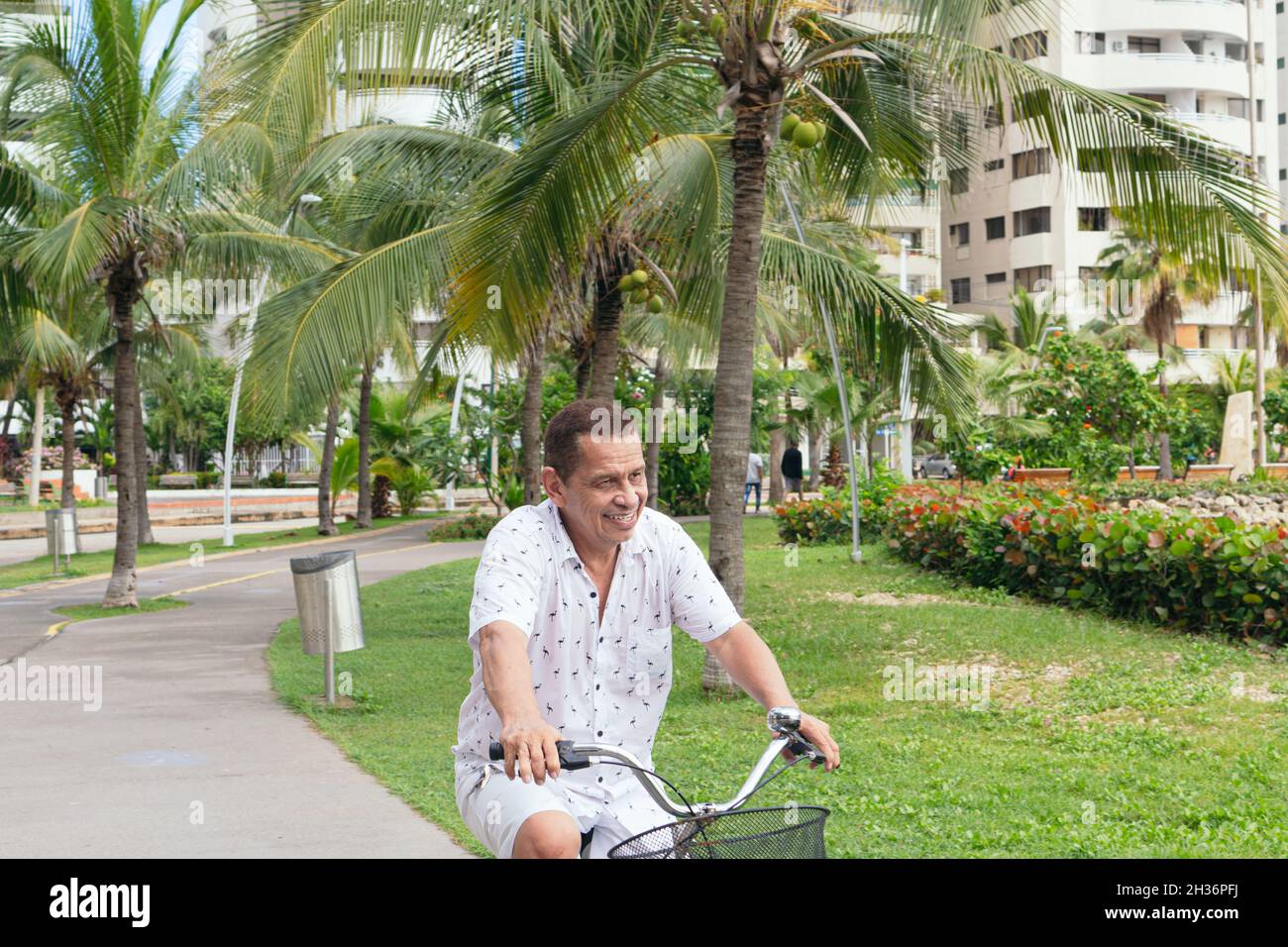 Hispanic Man Riding Bike Latino older man hi-res stock photography and images - Alamy