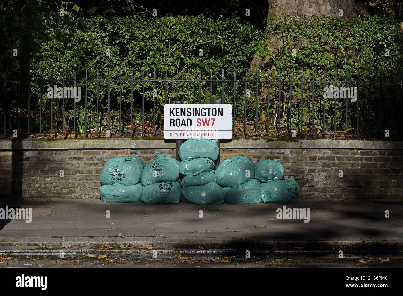 London, England, UK. Bags of 'street cleaning waste' piled up in
